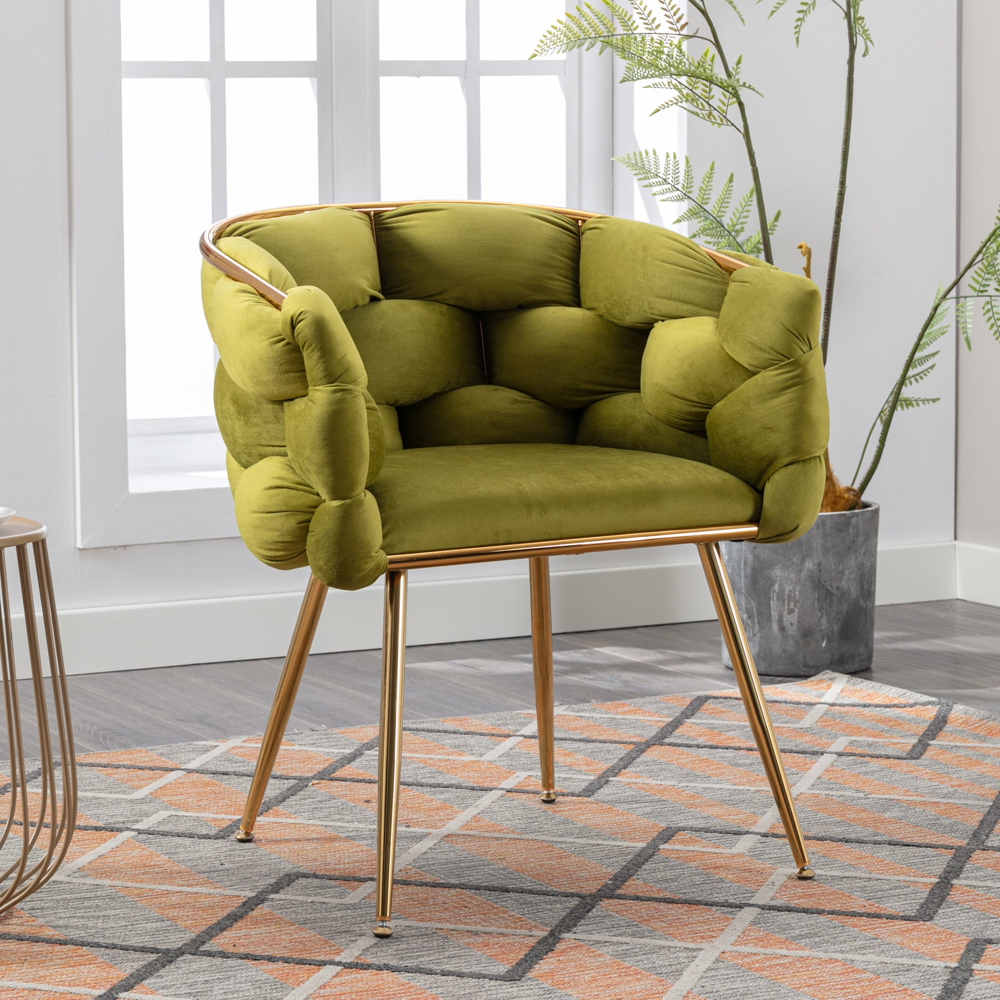 Plush lime green velvet accent chair with tufted design and gold metal legs