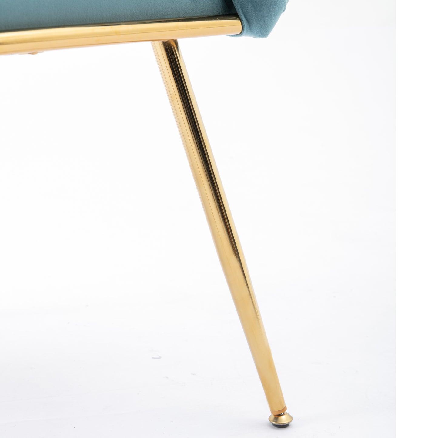 Teal velvet upholstered chair detail with slender gold metal legs