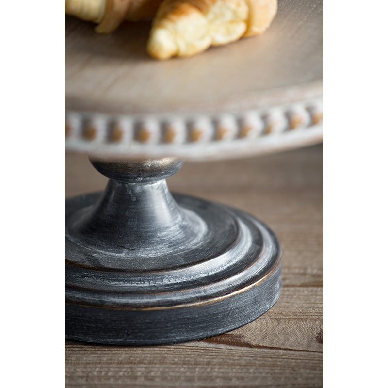 Distressed gray metal cake stand with beaded wood rim perfect for serving pastries