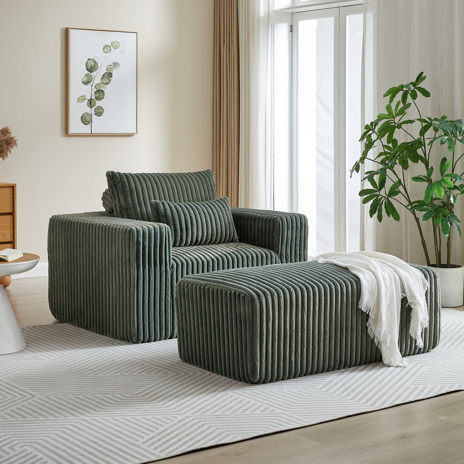 Plush green corduroy armchair with matching ottoman ideal for a modern living room