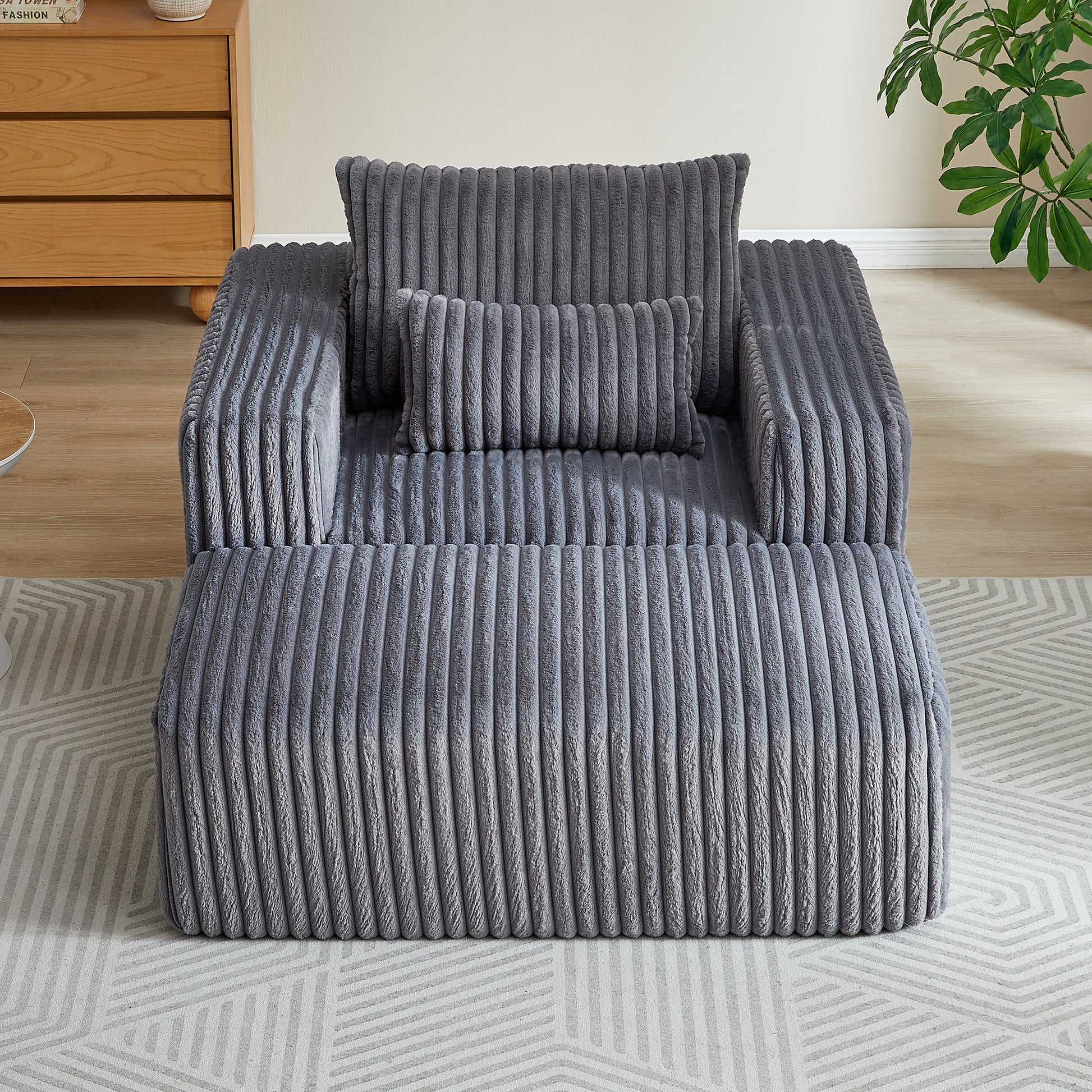 Plush grey corduroy single sofa chair with matching lumbar and back pillows