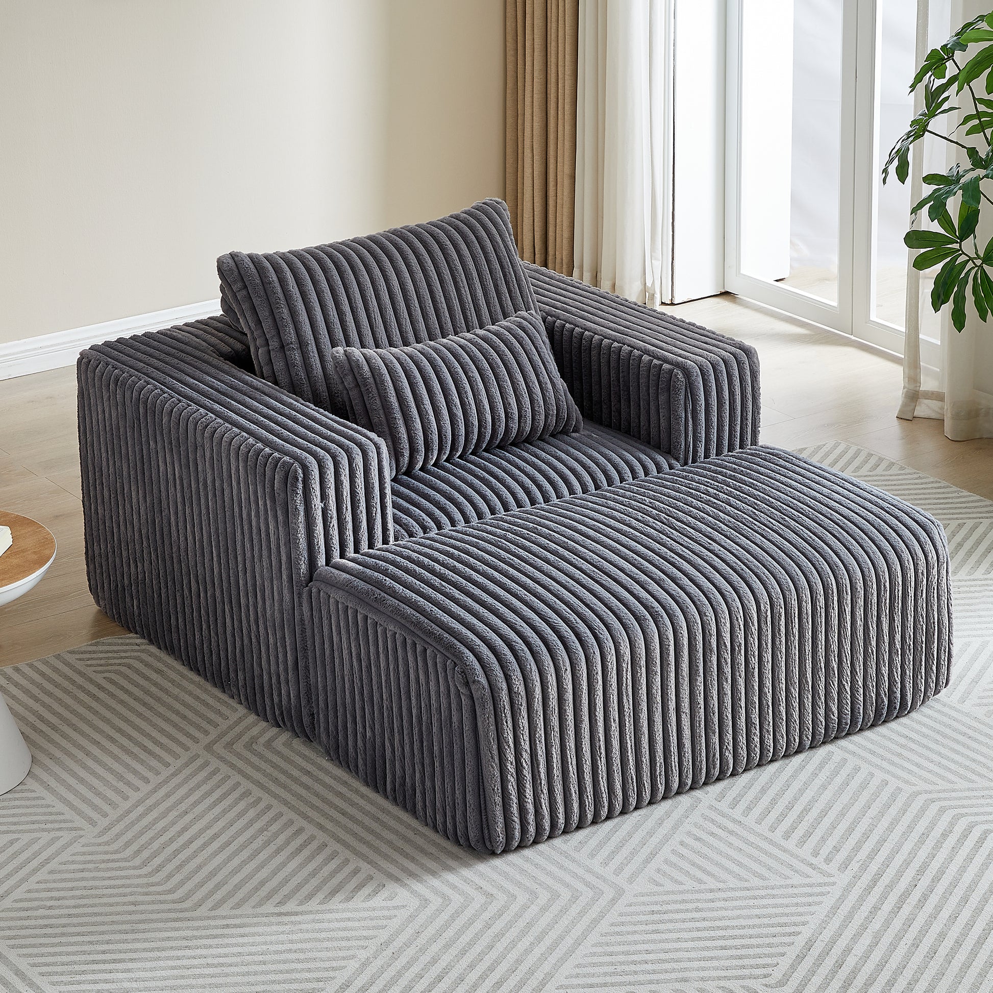 Plush grey corduroy sectional sofa with a modern modular design perfect for cozy living rooms