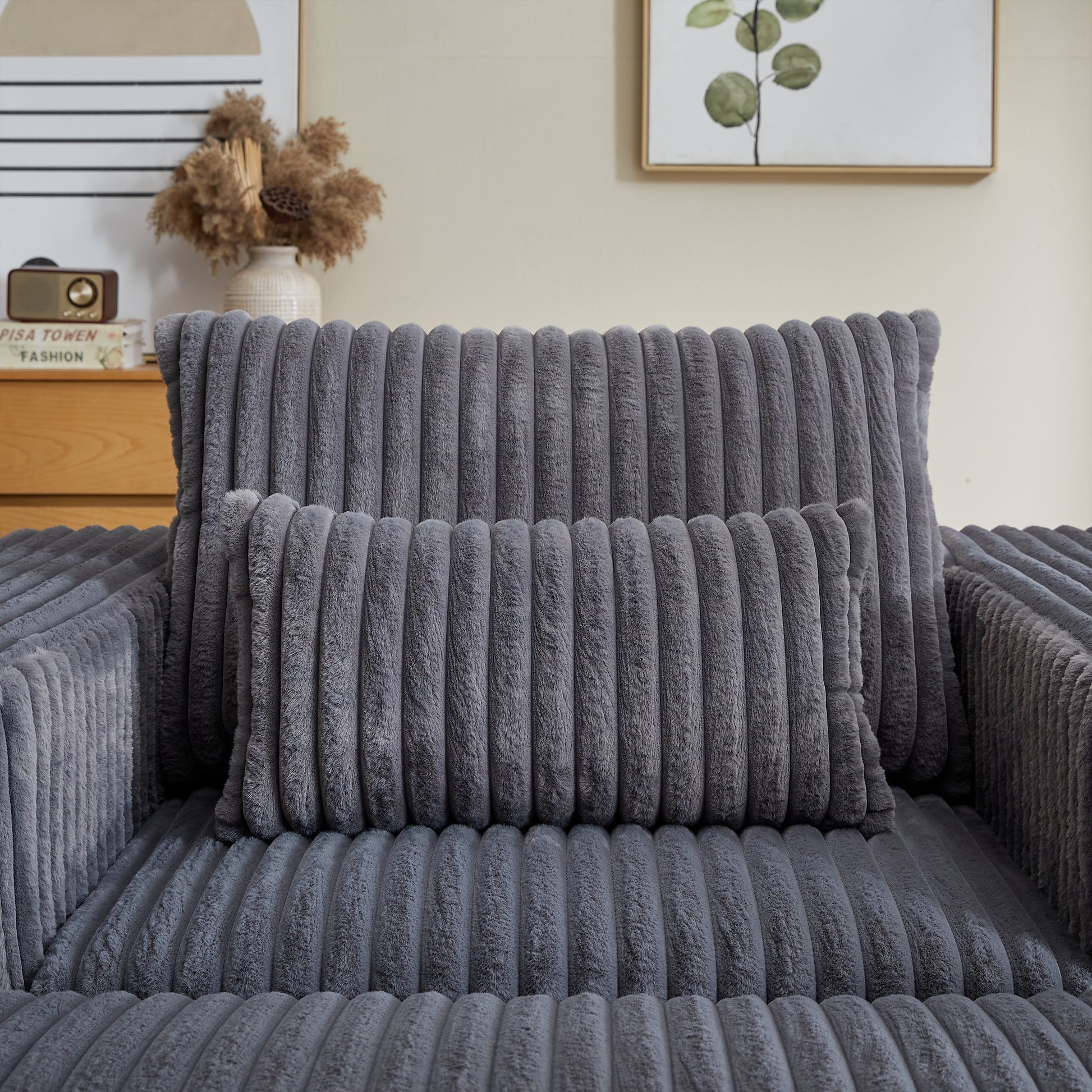 Plush dark grey corduroy throw pillow with vertical channel tufting for cozy home decor