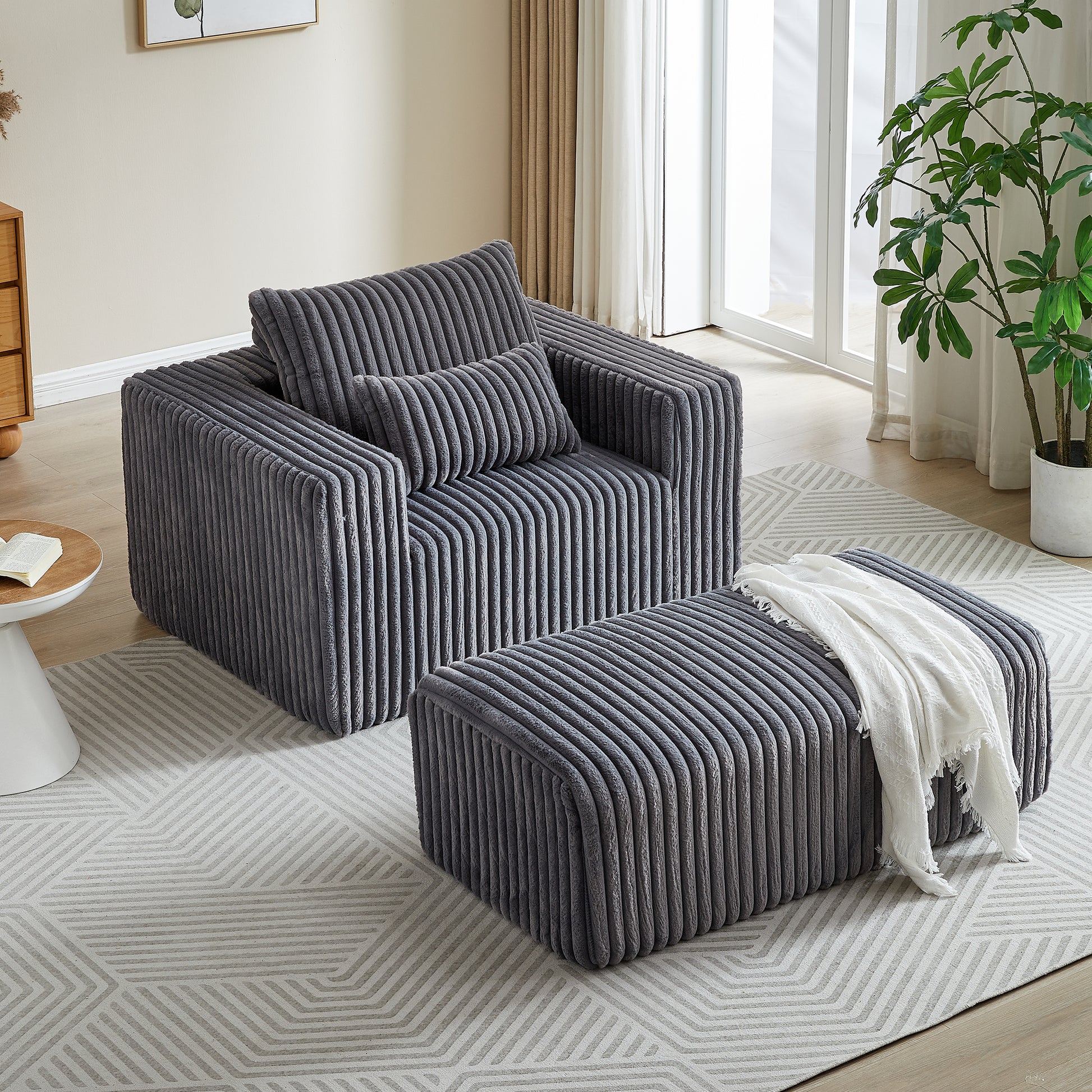 Plush grey corduroy armchair with matching ottoman modern living room seating