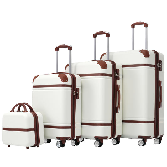 Four white vintagestyle luggage pieces with brown trim and wheels