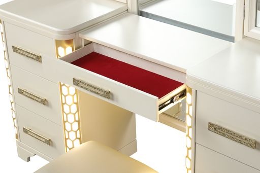 Cream vanity with open drawer and red velvet lining