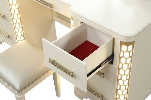 Cream upholstered vanity stool with golden accents