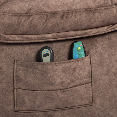 Brown recliner side pocket holding two remote controls one gray with buttons one green with functions