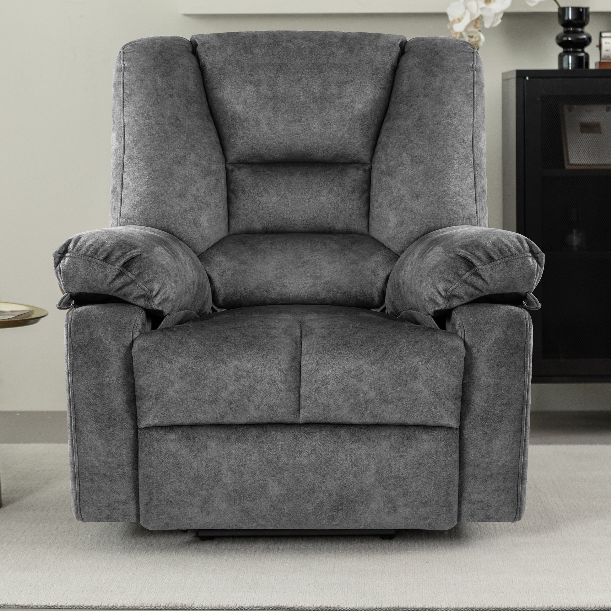 Plush charcoal gray recliner chair with overstuffed arms and headrest perfect for ultimate relaxation