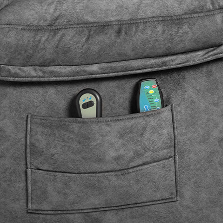 Grey fabric chair pocket with two remote controls one black and one green