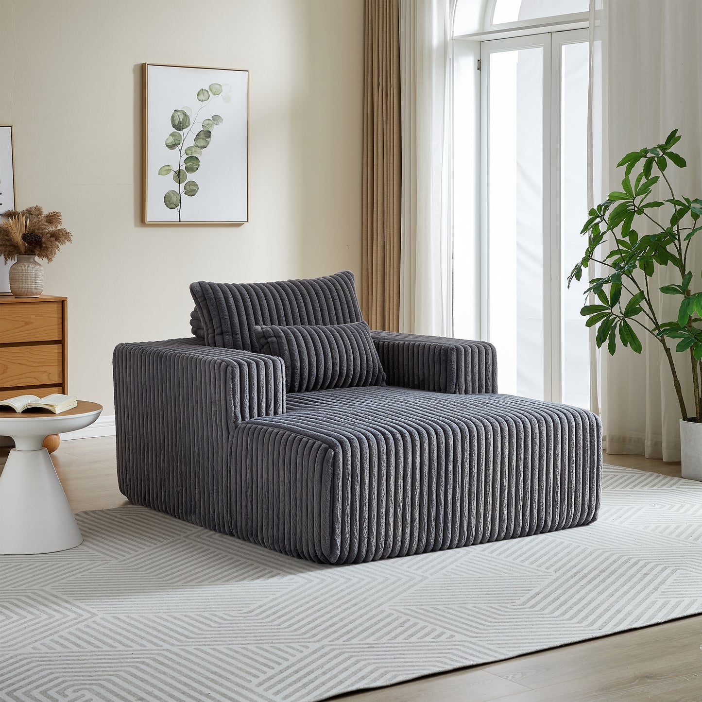 Plush grey corduroy modular chaise lounge with armrest and lumbar pillow