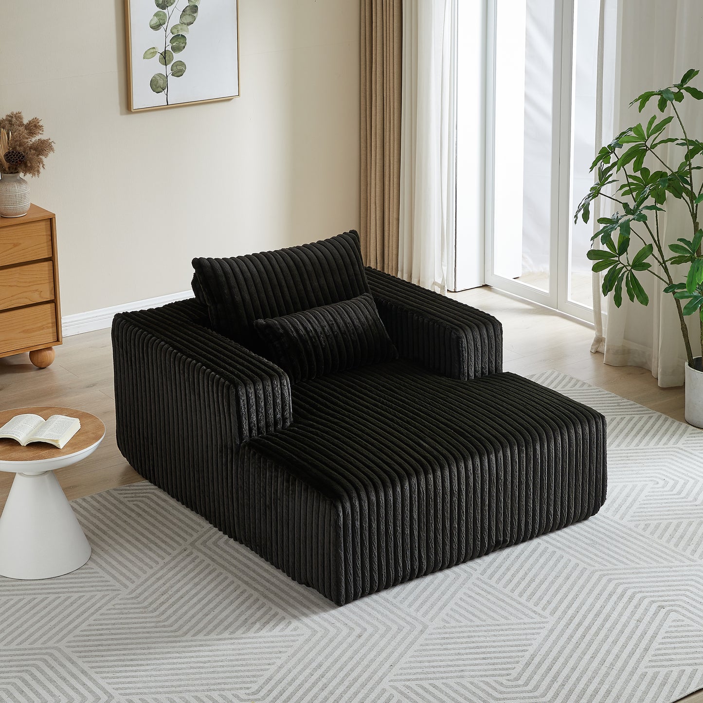 Plush black corduroy sectional sofa with textured fabric and matching throw pillows for modern living rooms