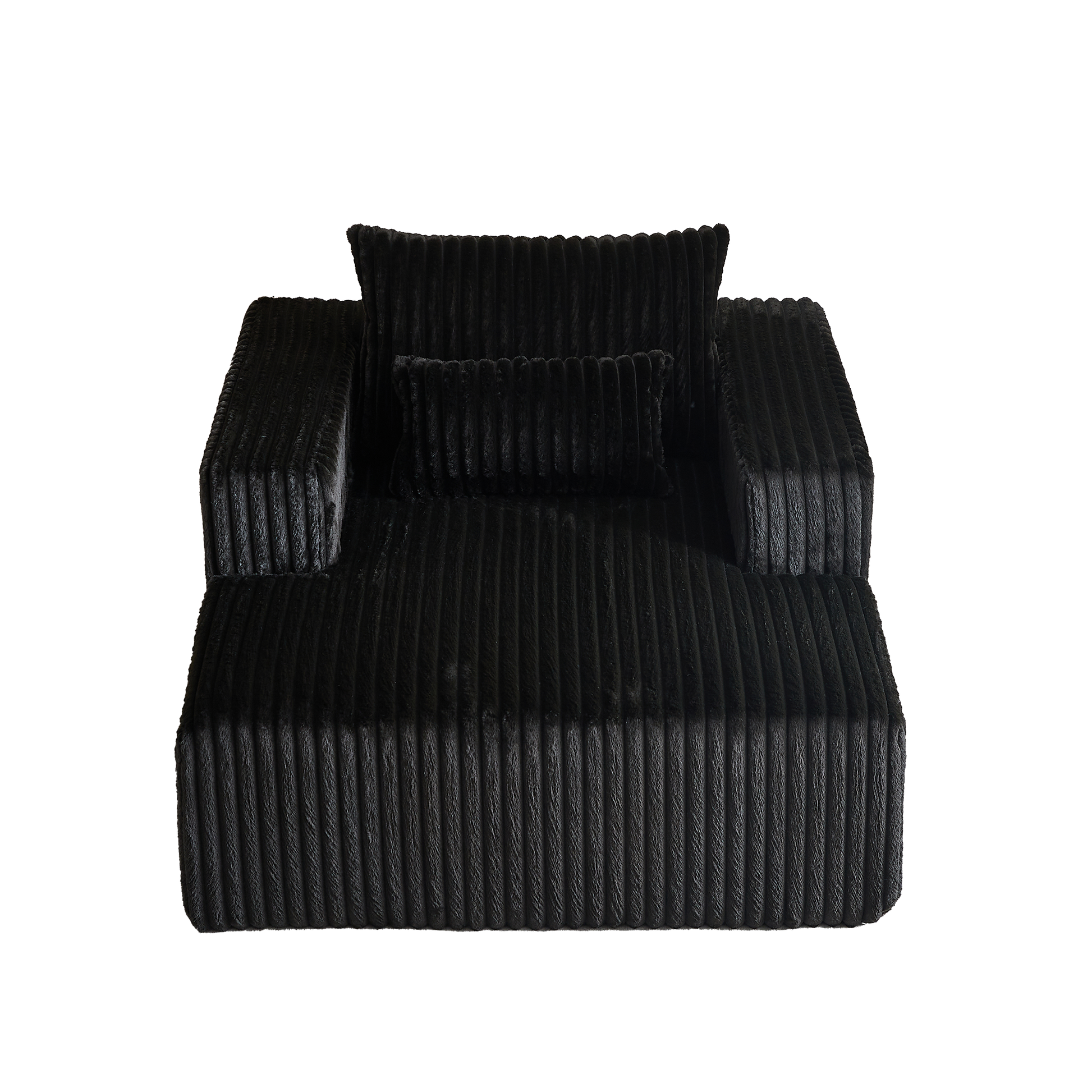 Black plush sofa with corduroy texture and two throw pillows