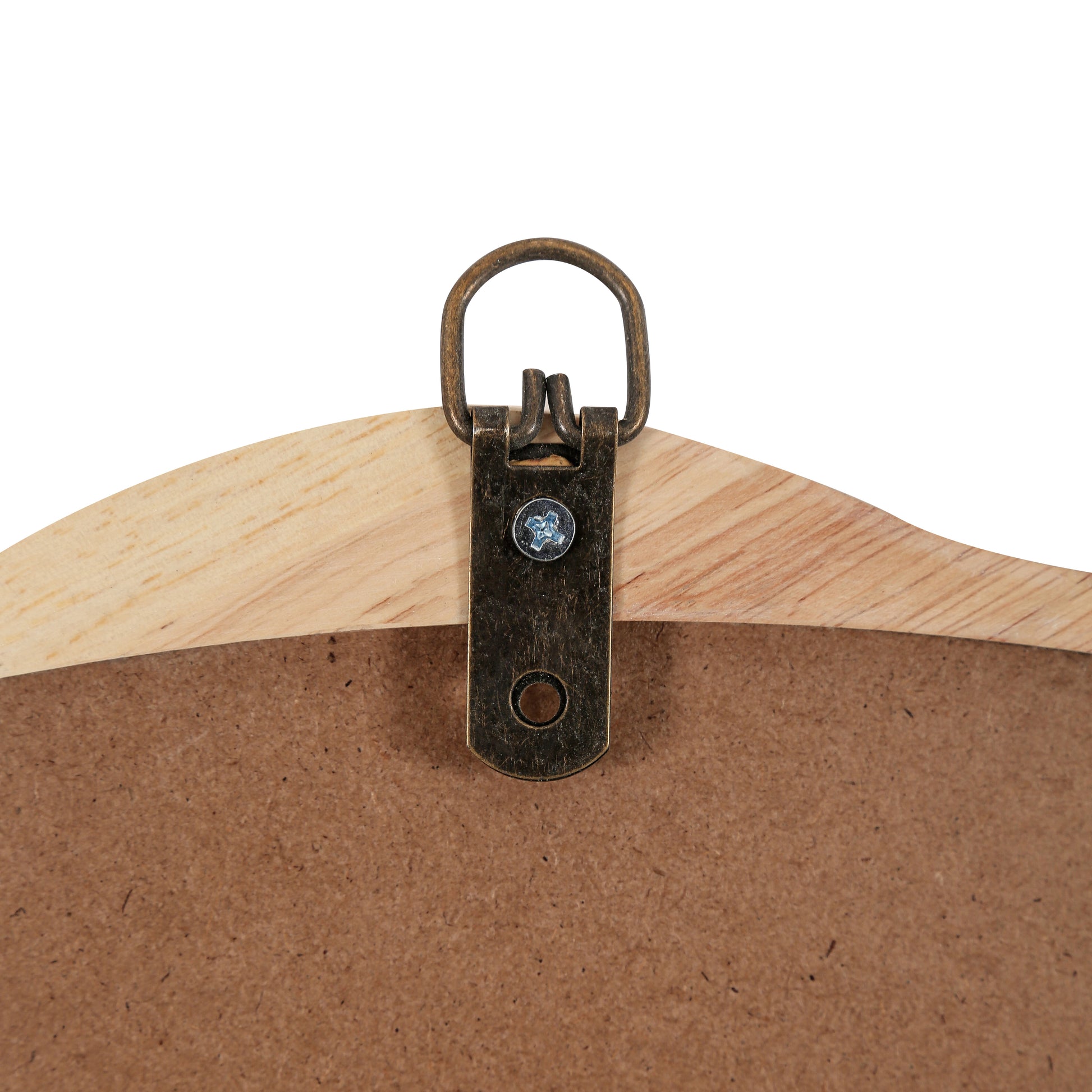 Closeup of a wooden picture frame backing with antique brass hanging hardware