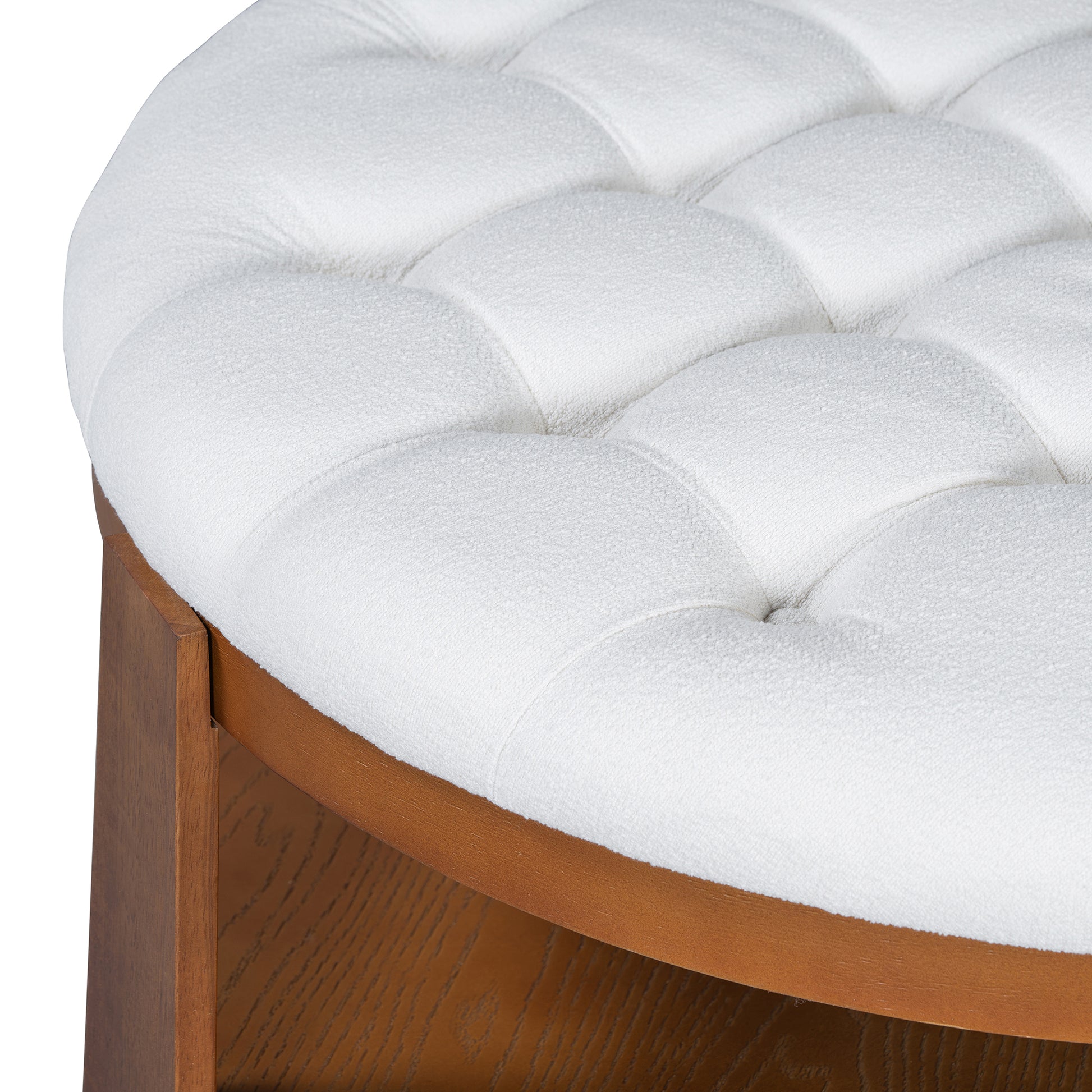 Round tufted white ottoman with a polished wood base