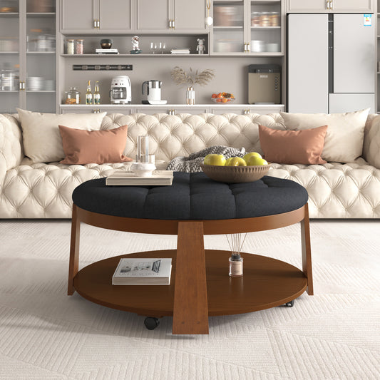 Tufted dark gray upholstered round ottoman coffee table with wooden base and wheels