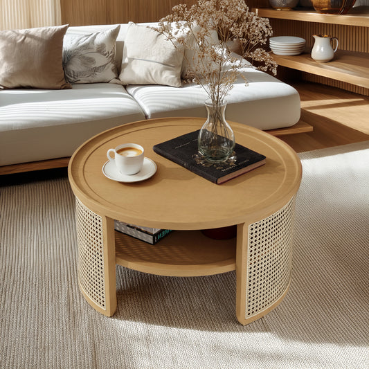 Round wood coffee table with cane detailing featuring a cup of coffee and a book