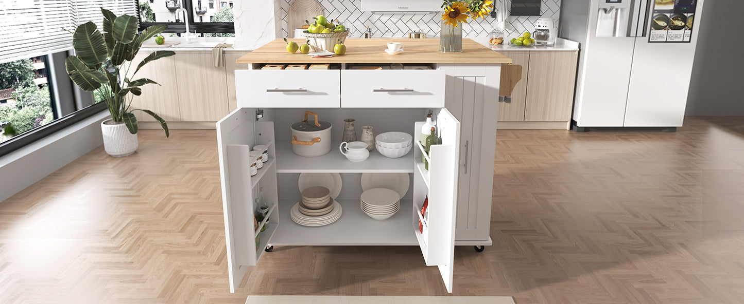White kitchen island with two drawers and open storage cabinets filled with cookware and dishes