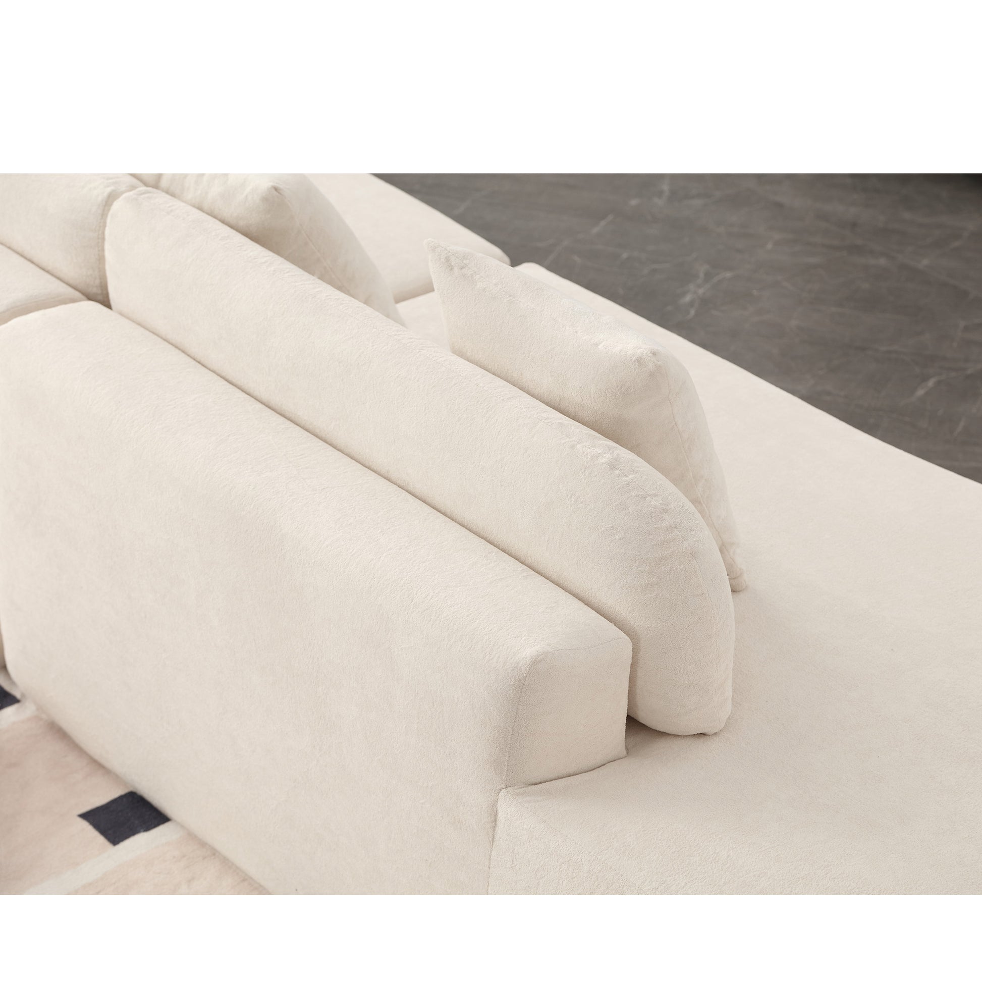 Plush cream boucle modular sofa with curved back cushions perfect for a modern living room