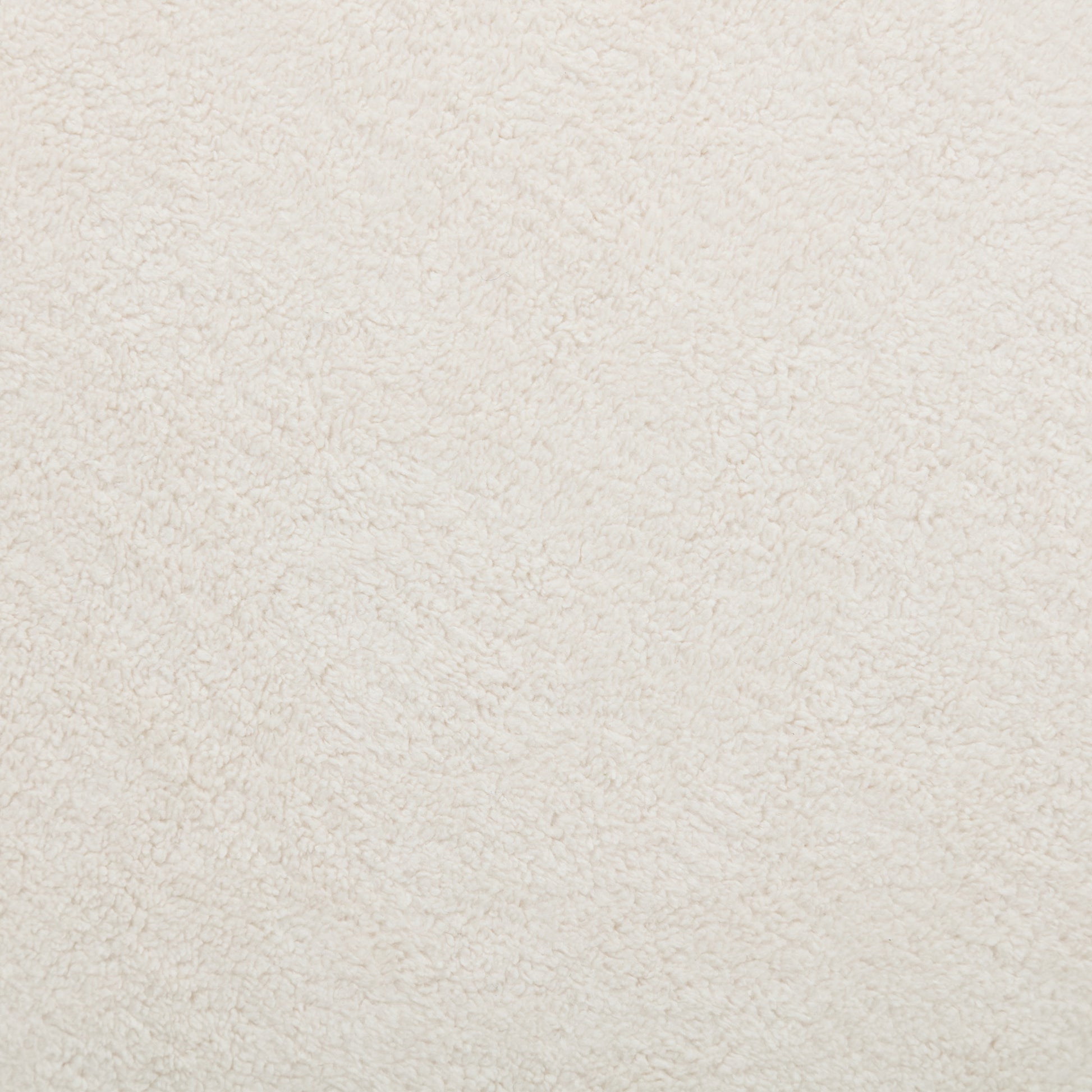 Cozy cream sherpa fabric swatch with fluffy texture for crafting projects