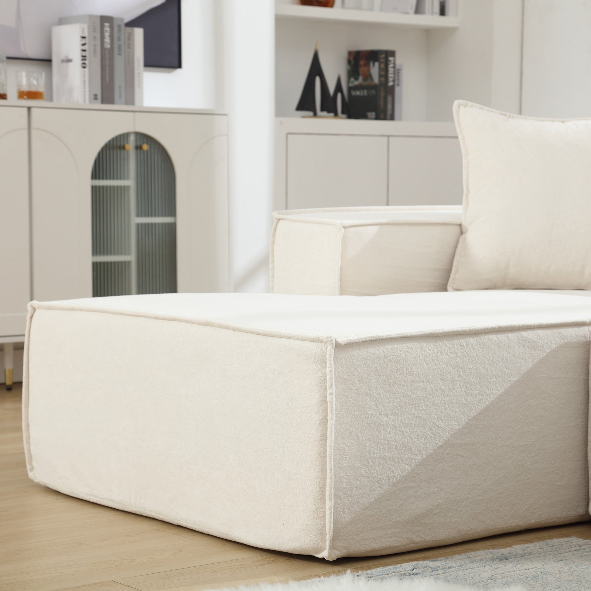 Cream boucle fabric sectional sofa with deep seating and plush cushions for comfort