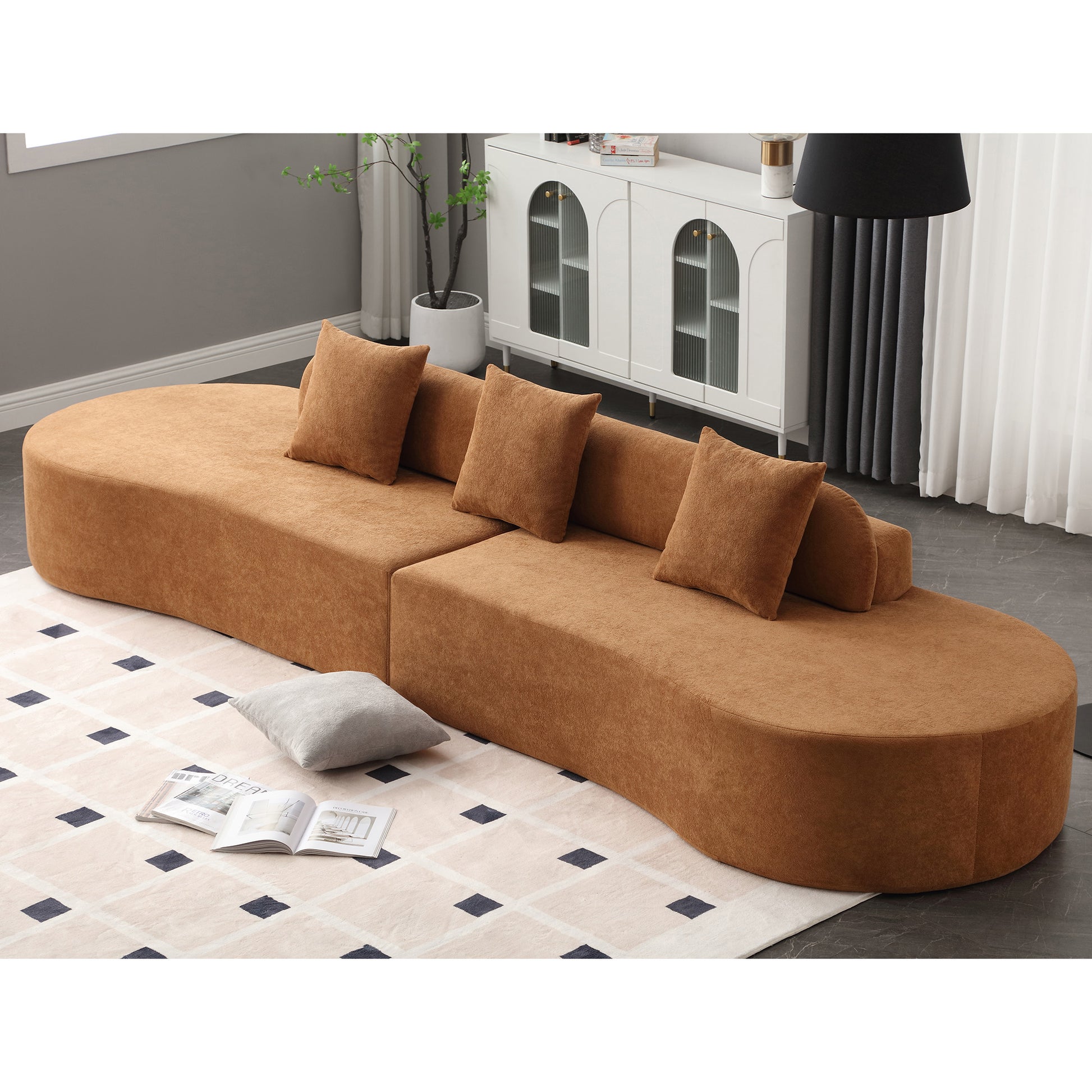 Curved modular velvet sofa in warm brown perfect for modern living room seating