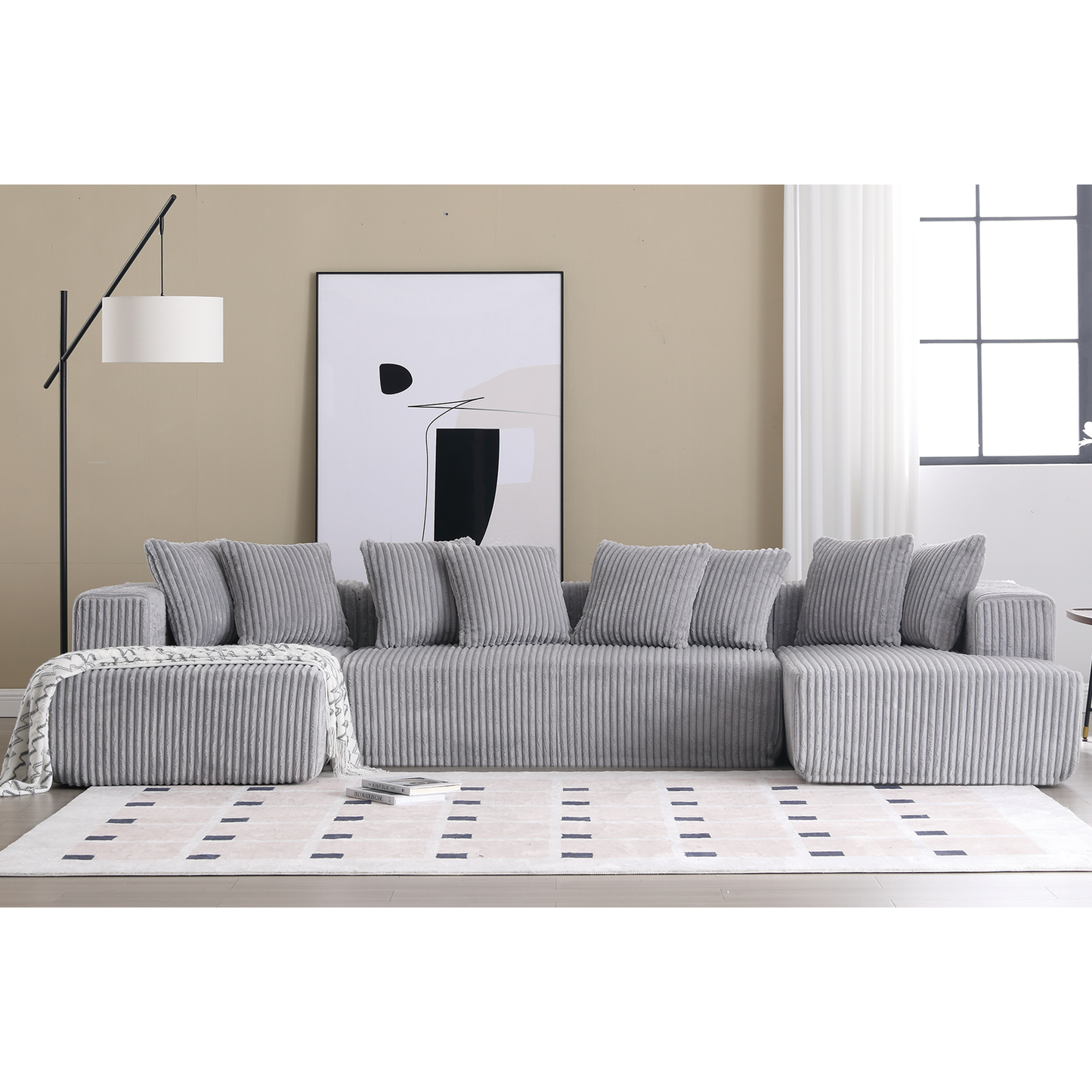 Plush gray sectional sofa with ribbed texture and matching throw pillows
