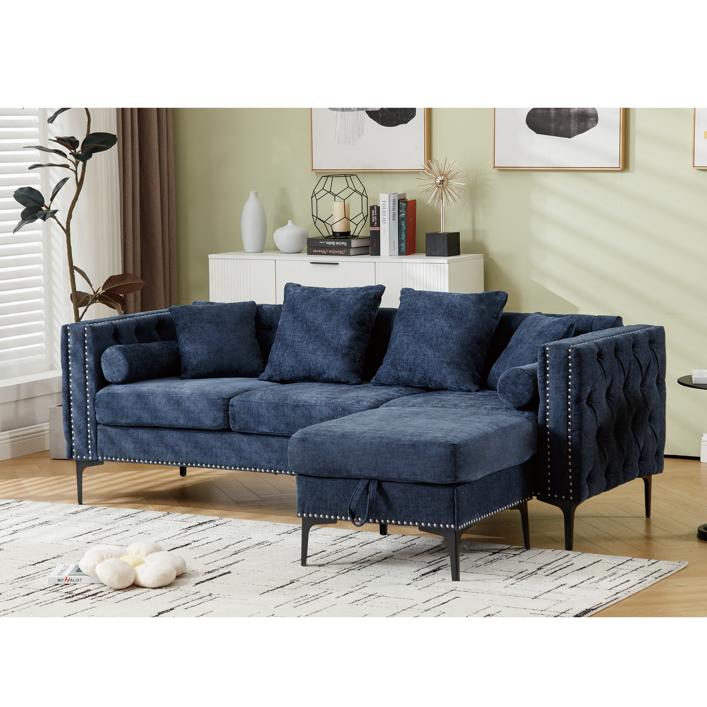 Navy blue tufted sectional sofa with chaise and silver nailhead trim