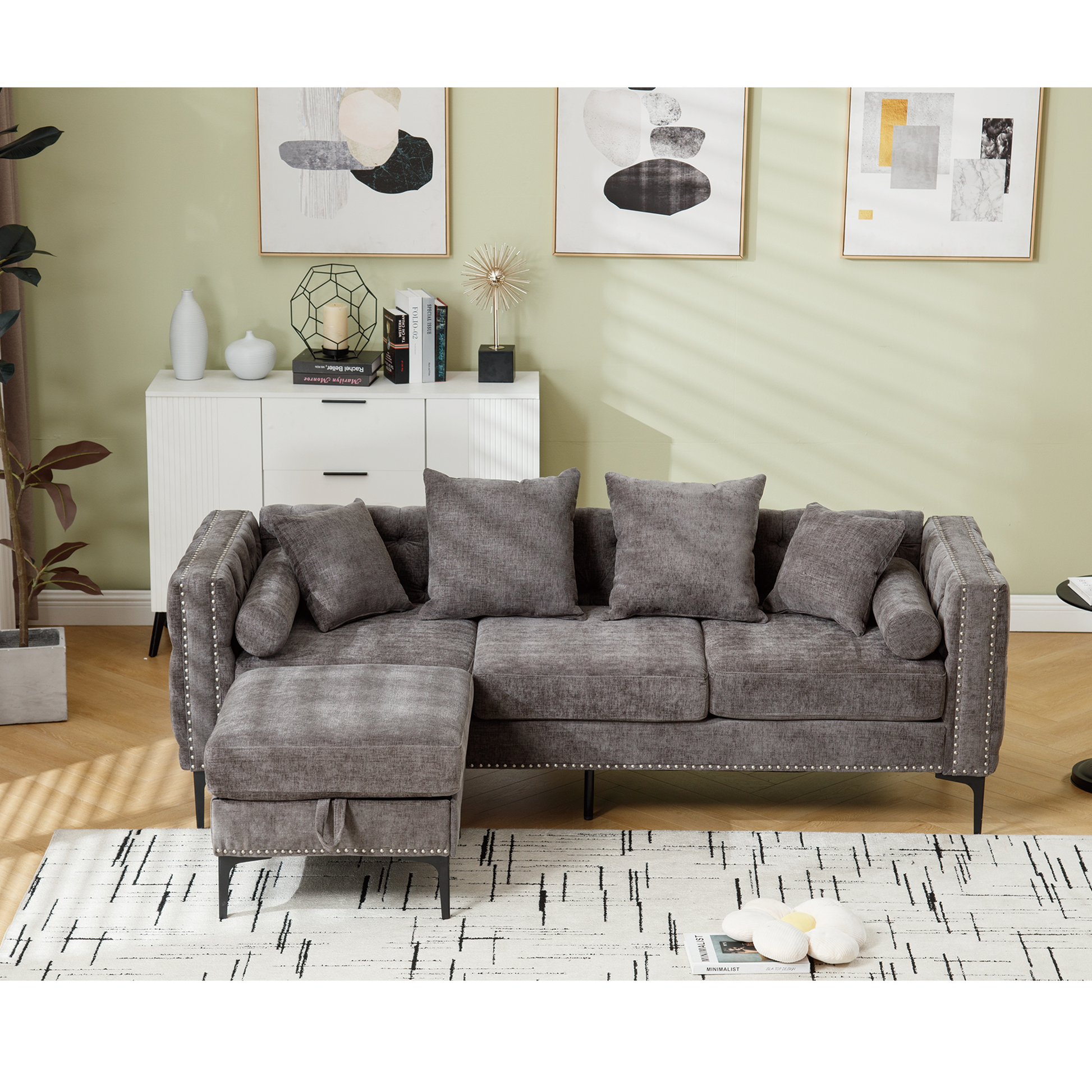 Gray tufted fabric sectional sofa with nailhead trim and storage ottoman