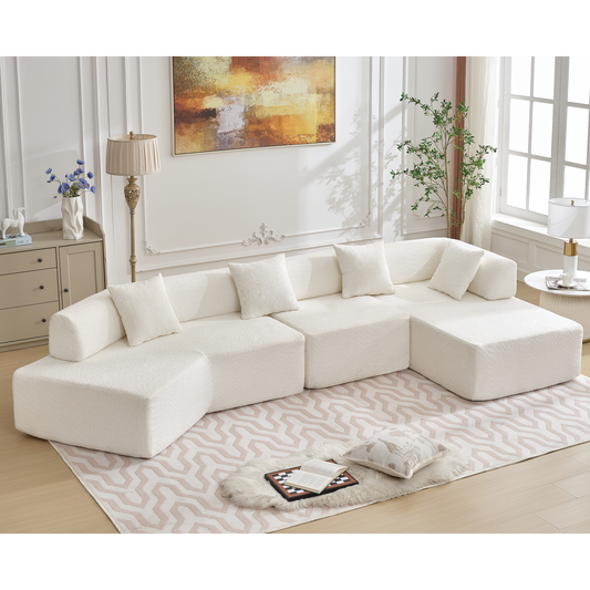Plush white sectional sofa with modular cubes and matching throw pillows