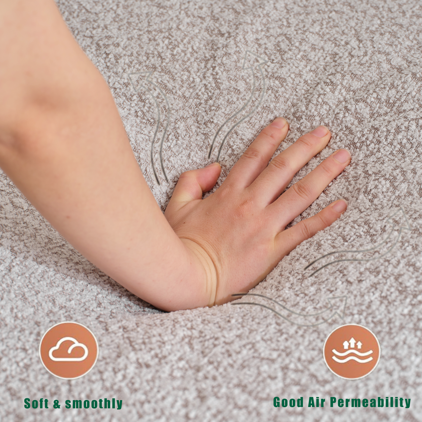 Close up of hand pressing into plush textured beige fabric demonstrating softness