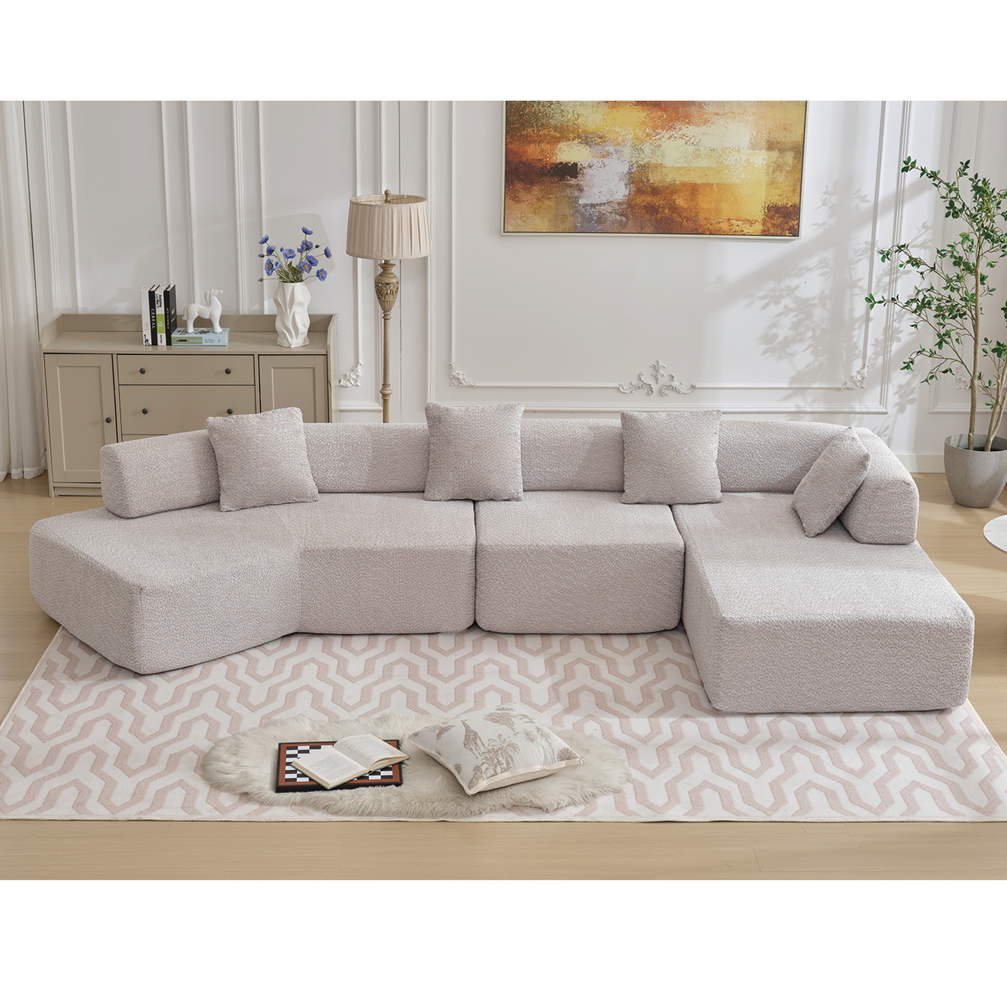 Modular boucl sectional sofa in light grey with scatter cushions for comfortable living room seating