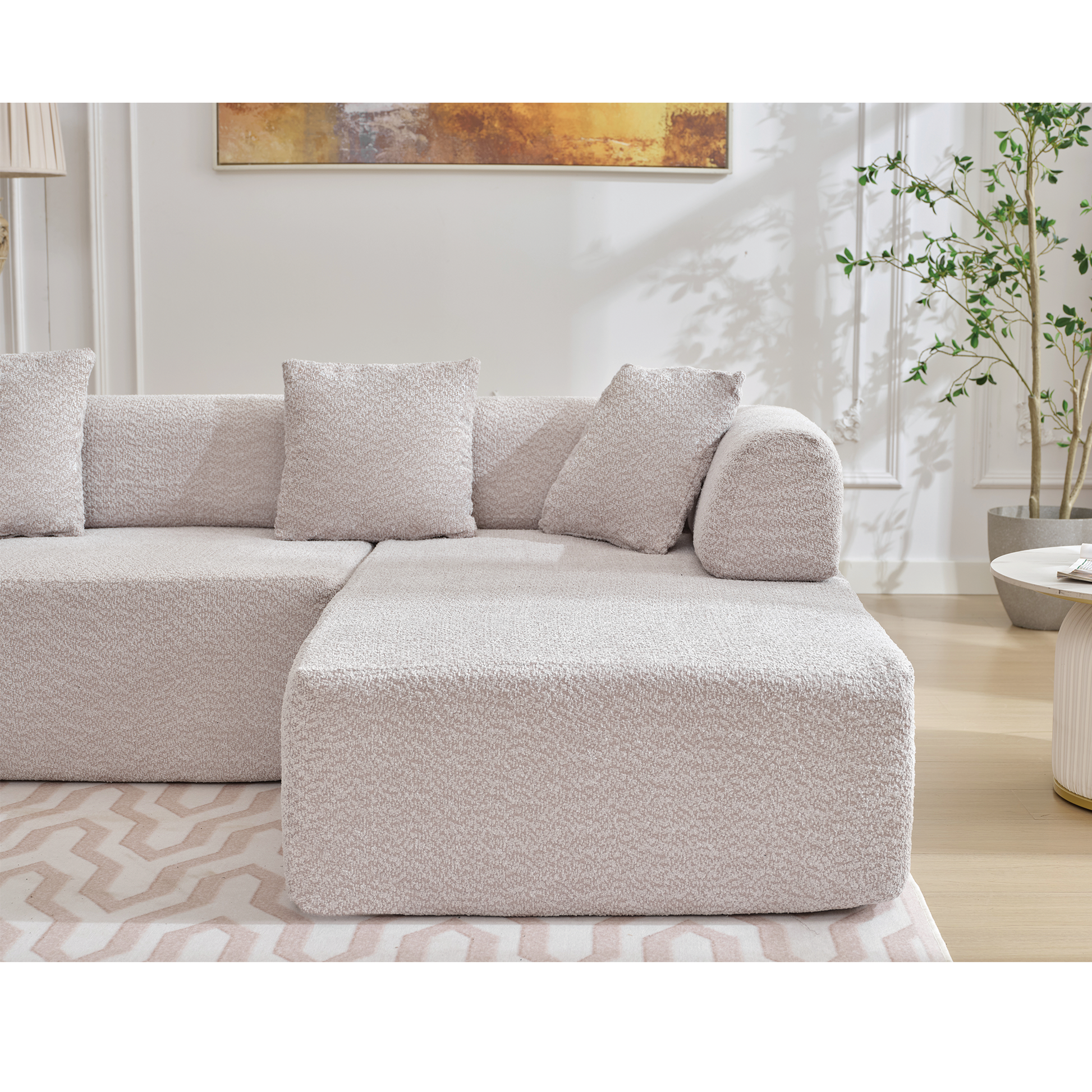 Modern light beige sectional sofa with textured fabric and lumbar pillows
