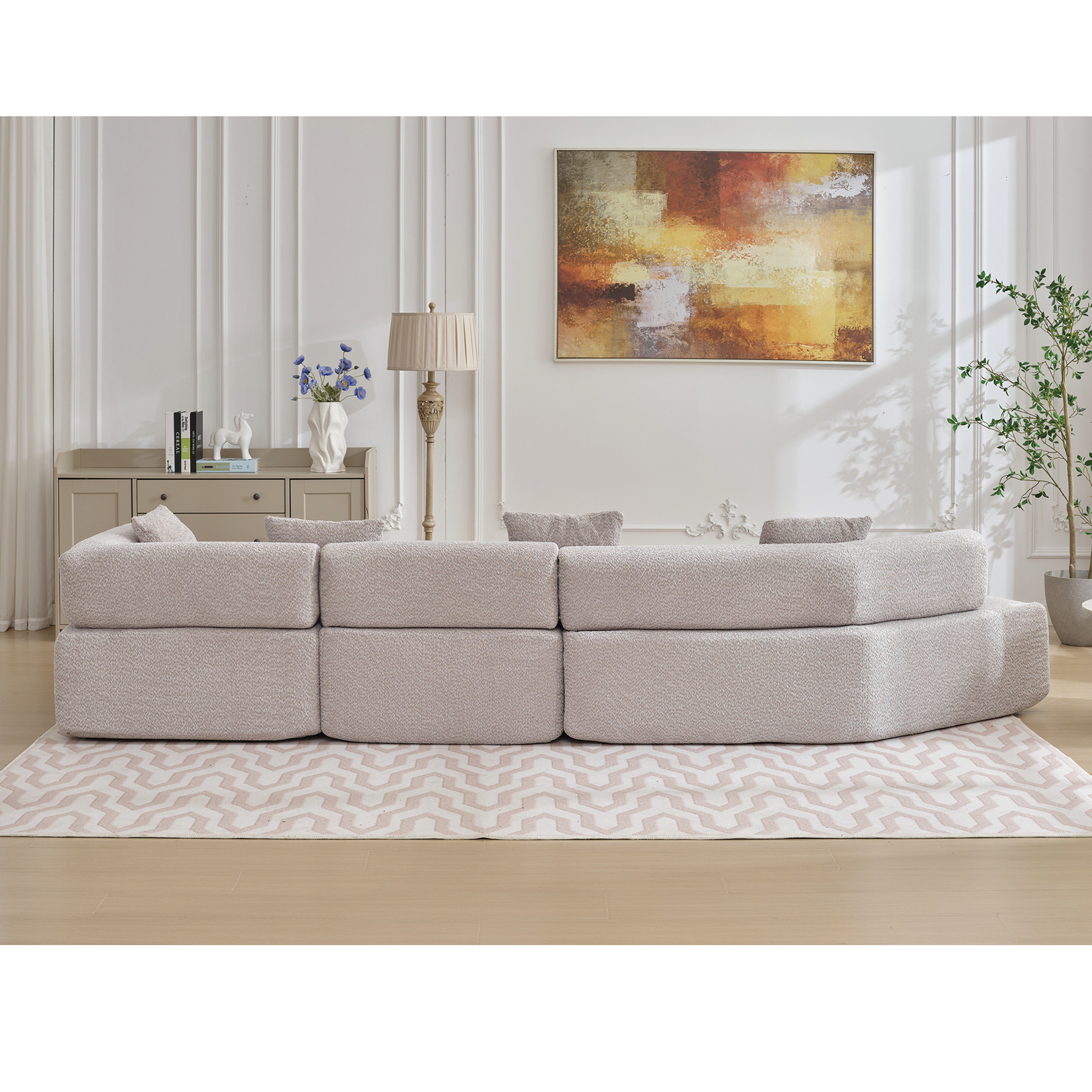 Curved sectional sofa in neutral boucle fabric ideal for modern living rooms
