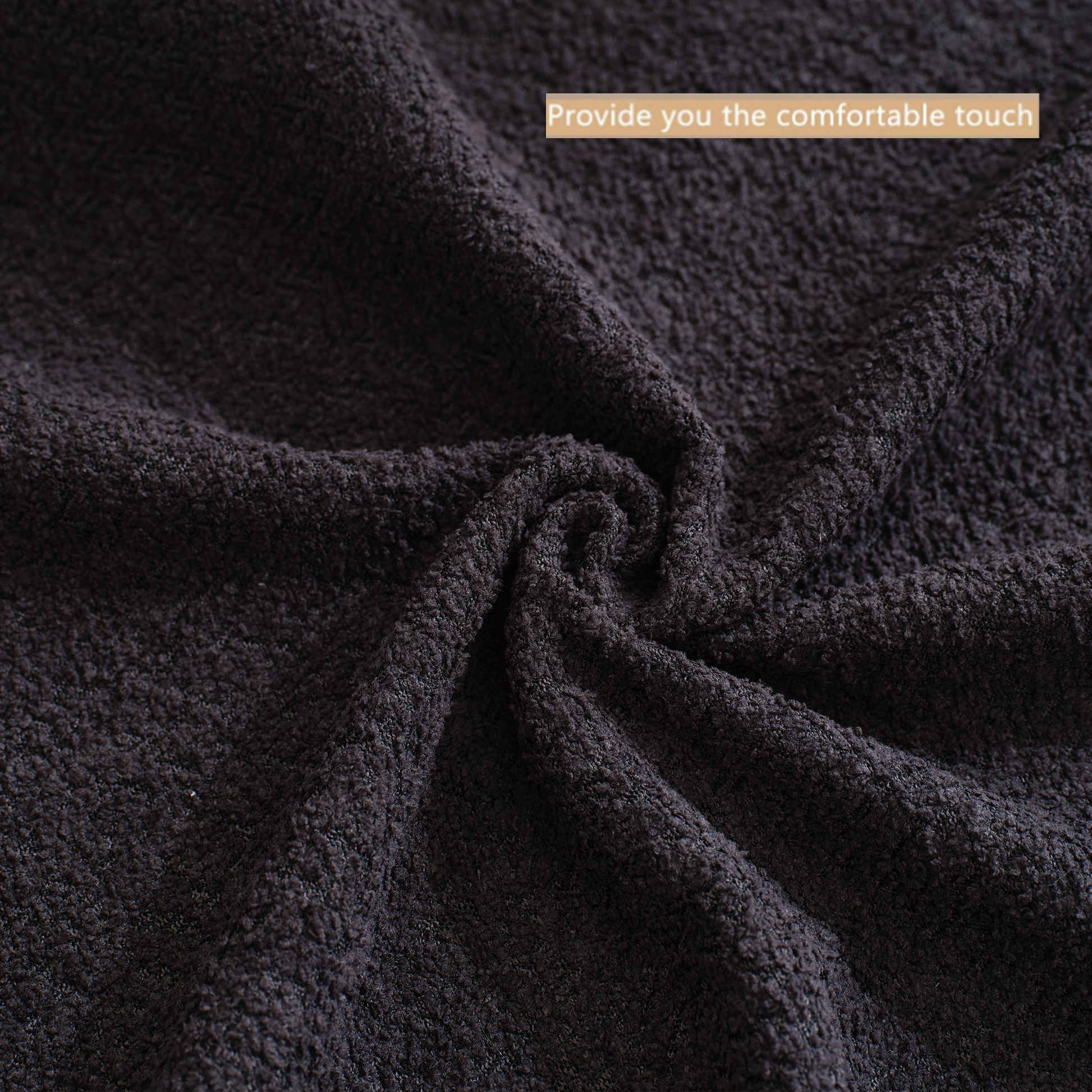 Dark grey textured fabric soft fleece material with a plush feel
