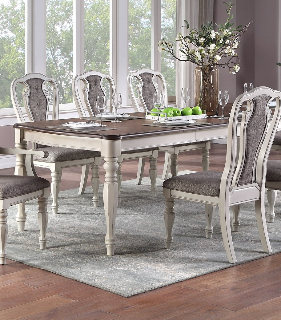 Rustic farm dining table with upholstered chairs and decorative vase