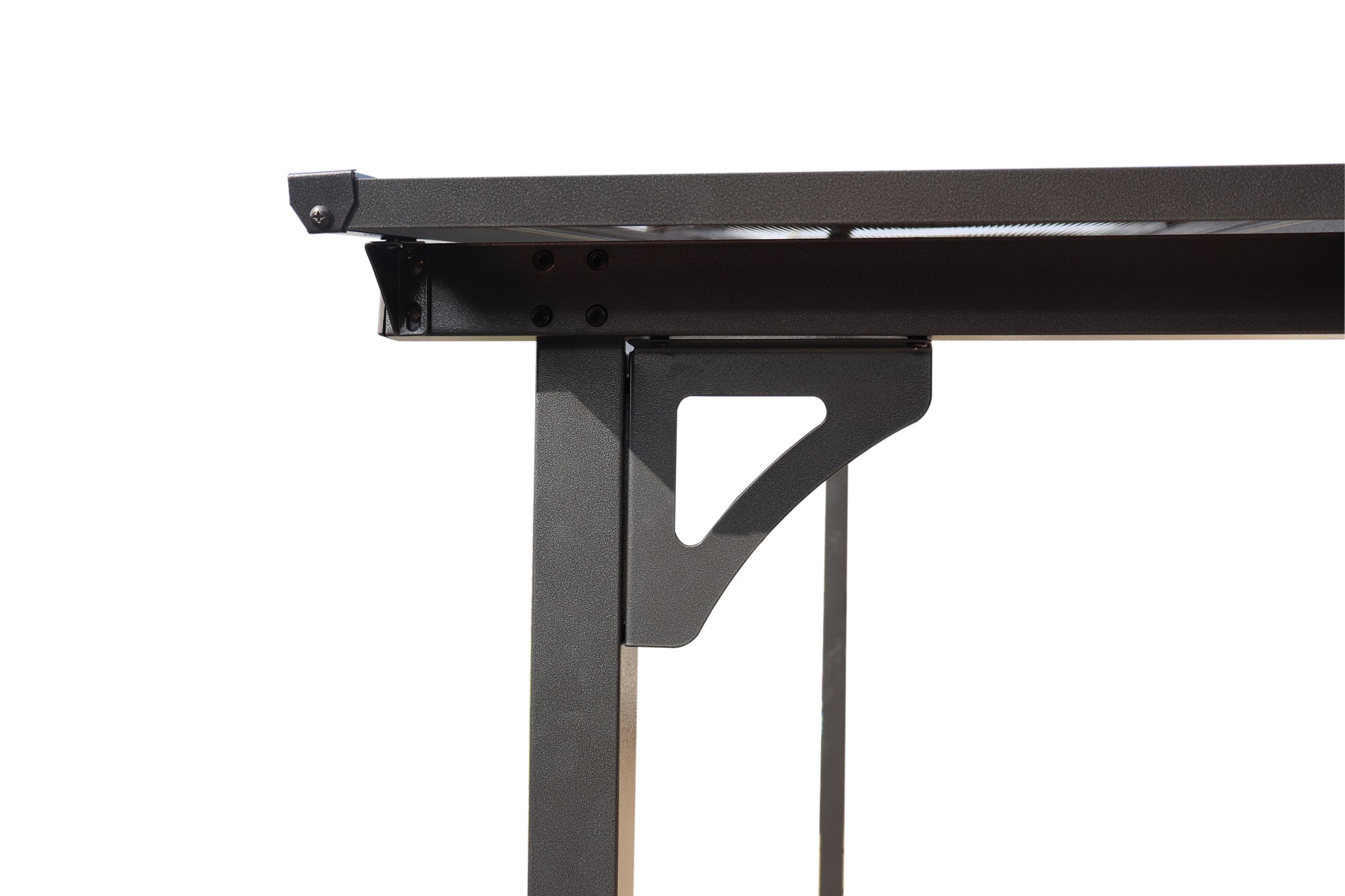 Closeup of dark gray textured metal table leg brace with triangular cutout