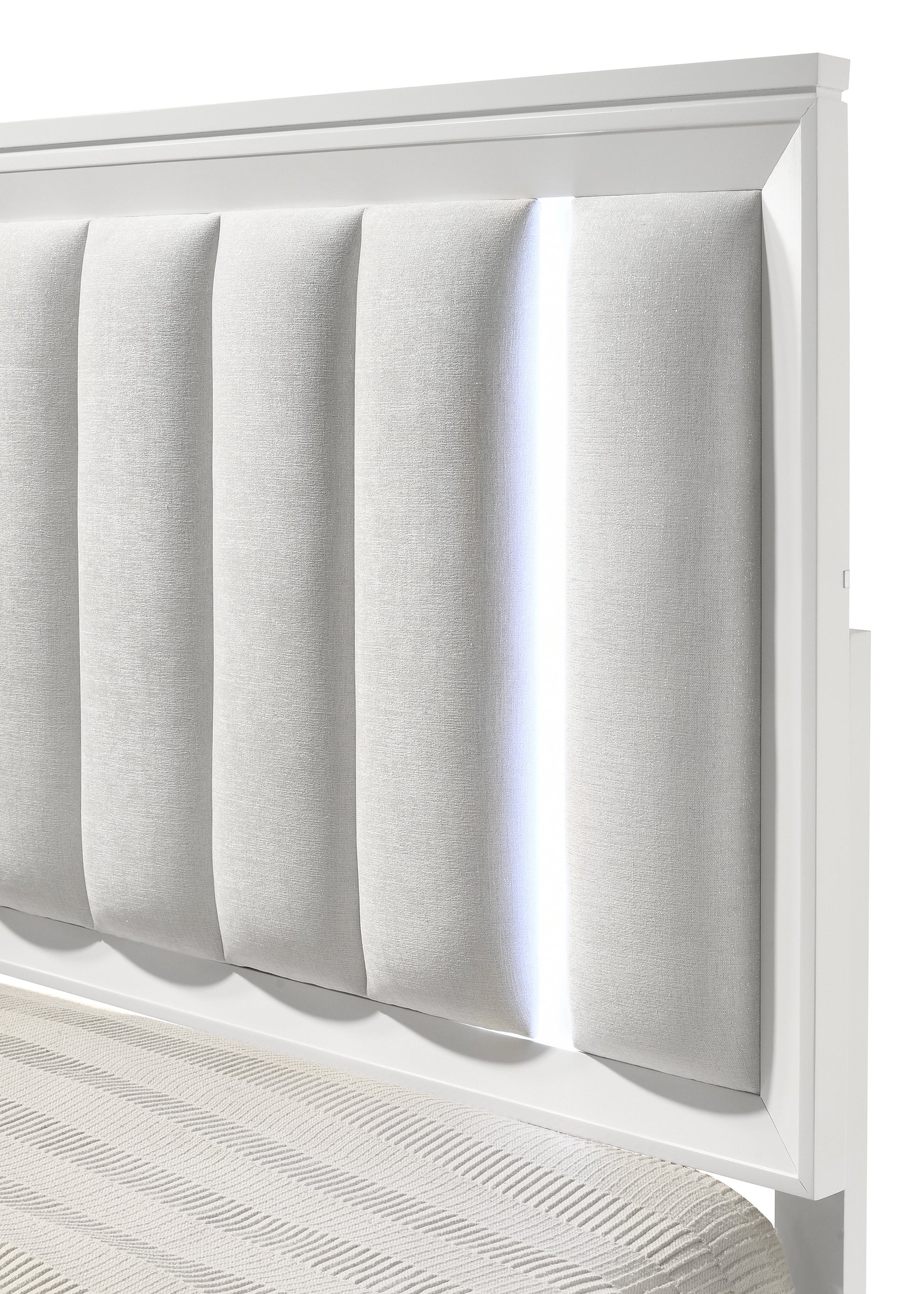 White upholstered headboard with vertical channels and integrated LED lighting perfect for a modern bedroom