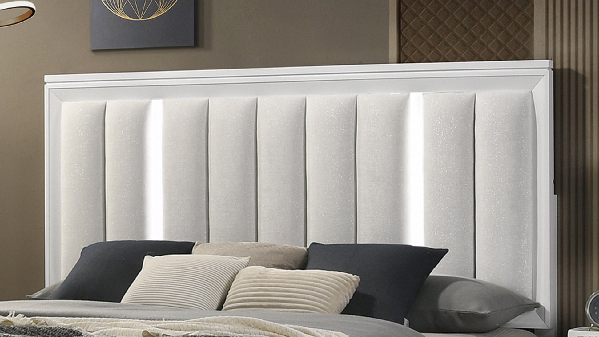White upholstered bed headboard with vertical tufting and integrated LED lights