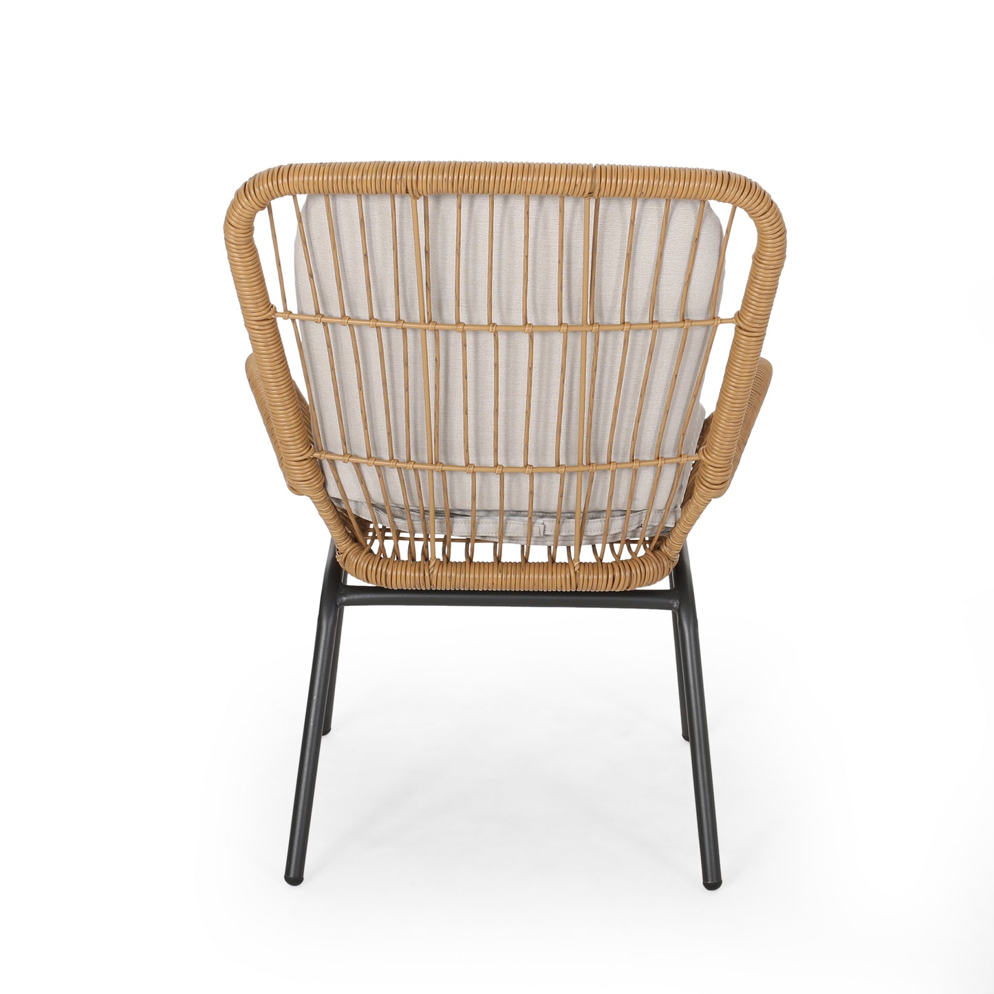 Natural rattan accent chair with light grey cushion and black metal legs