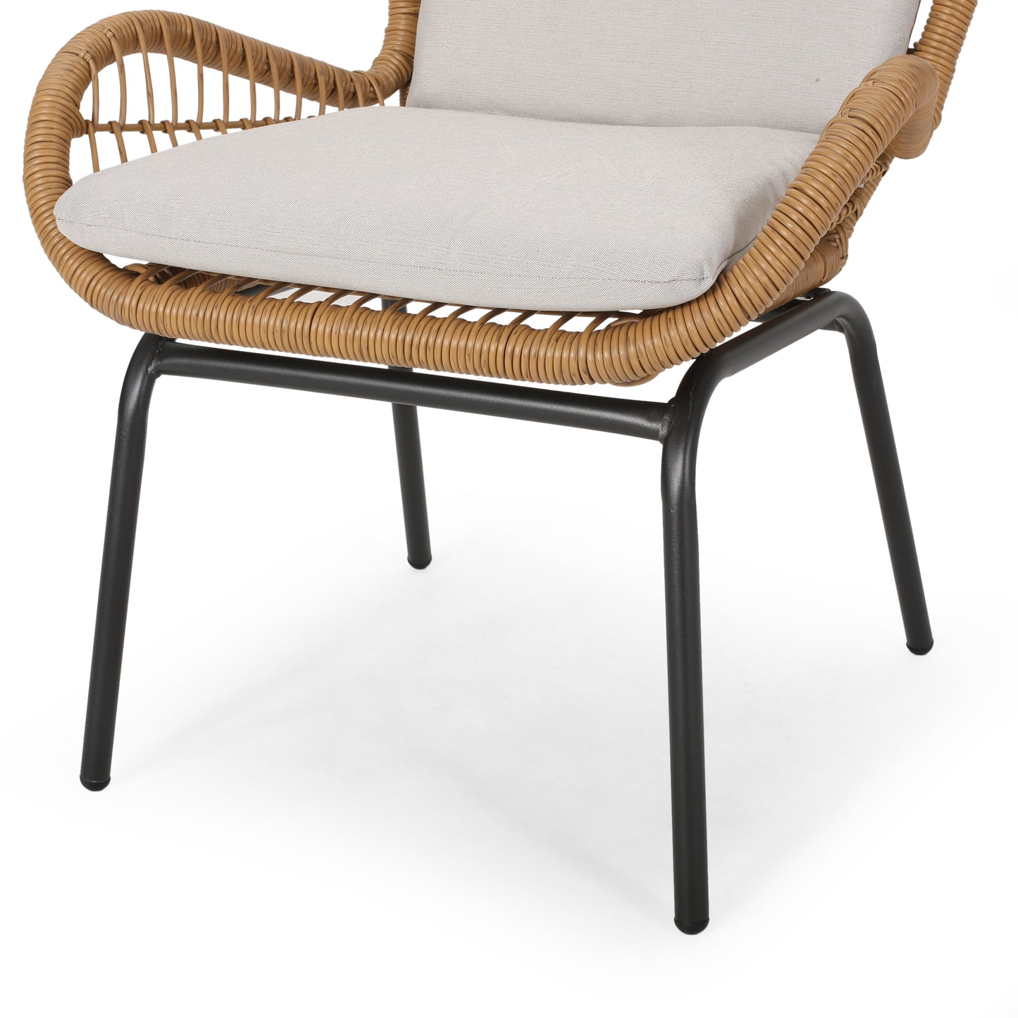 Closeup of a modern wicker chair with black metal legs and a beige cushion
