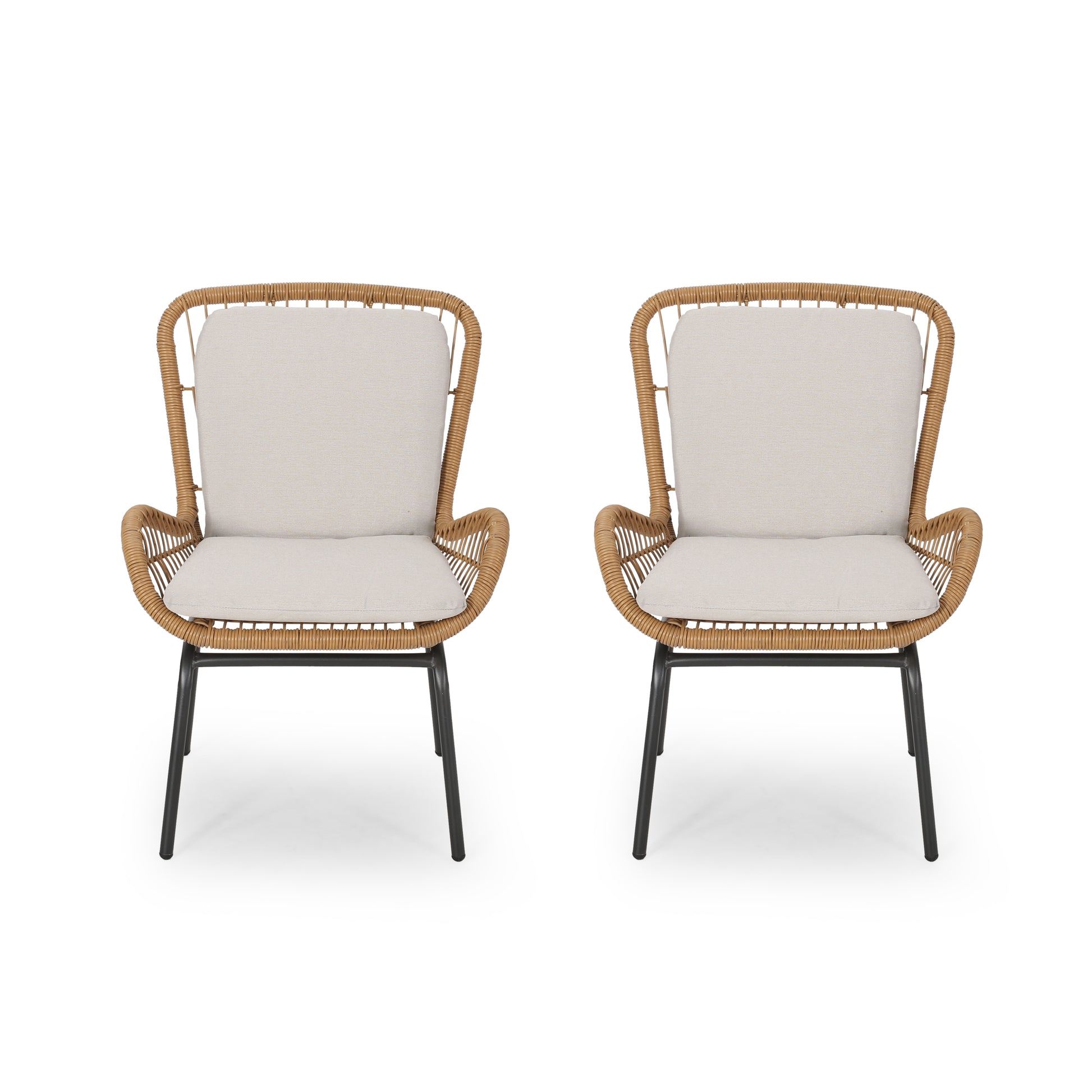 Two natural rattan accent chairs with beige cushions and black metal legs perfect for patio decor