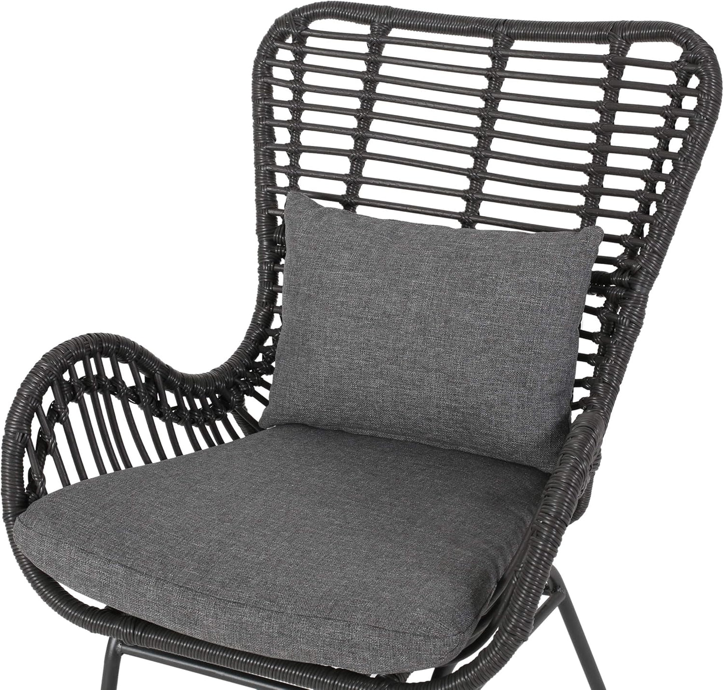 Dark gray wicker patio chair with comfortable charcoal cushions and a high backrest