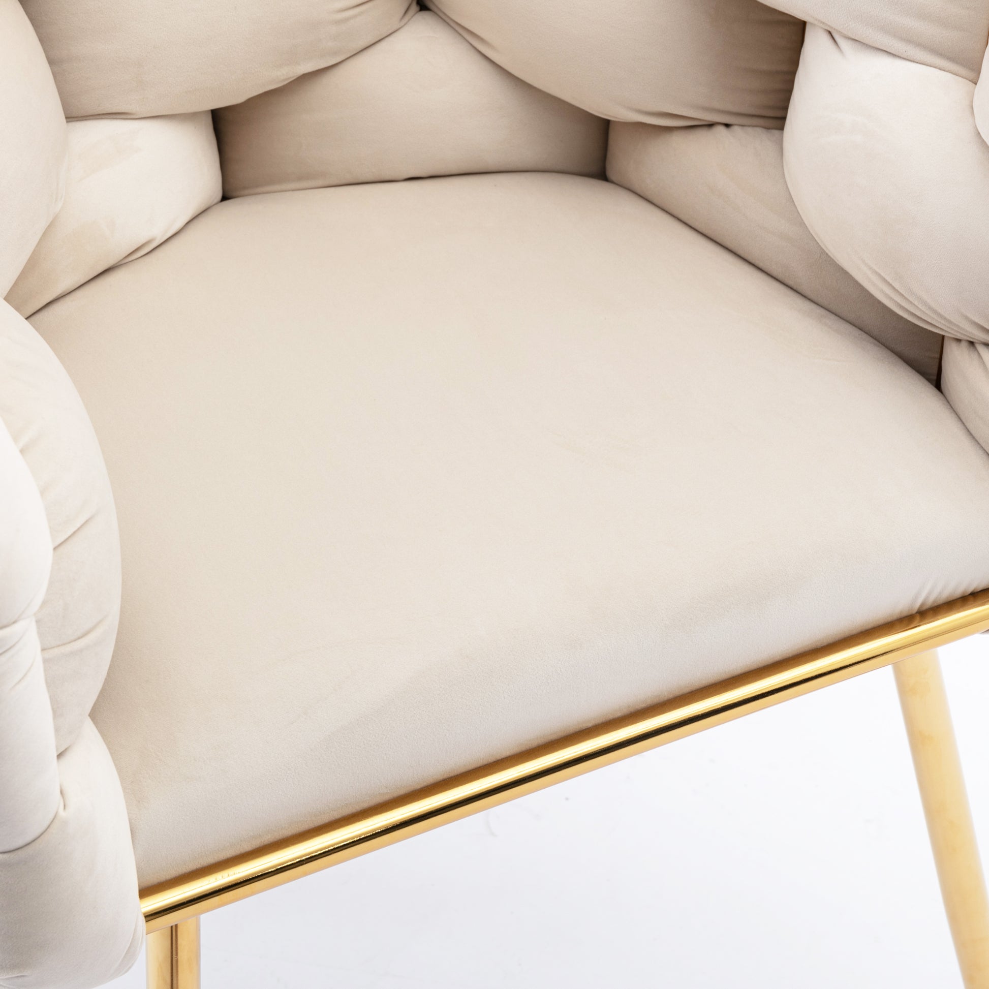 Plush cream velvet accent chair with tufted backrest and gold metal legs
