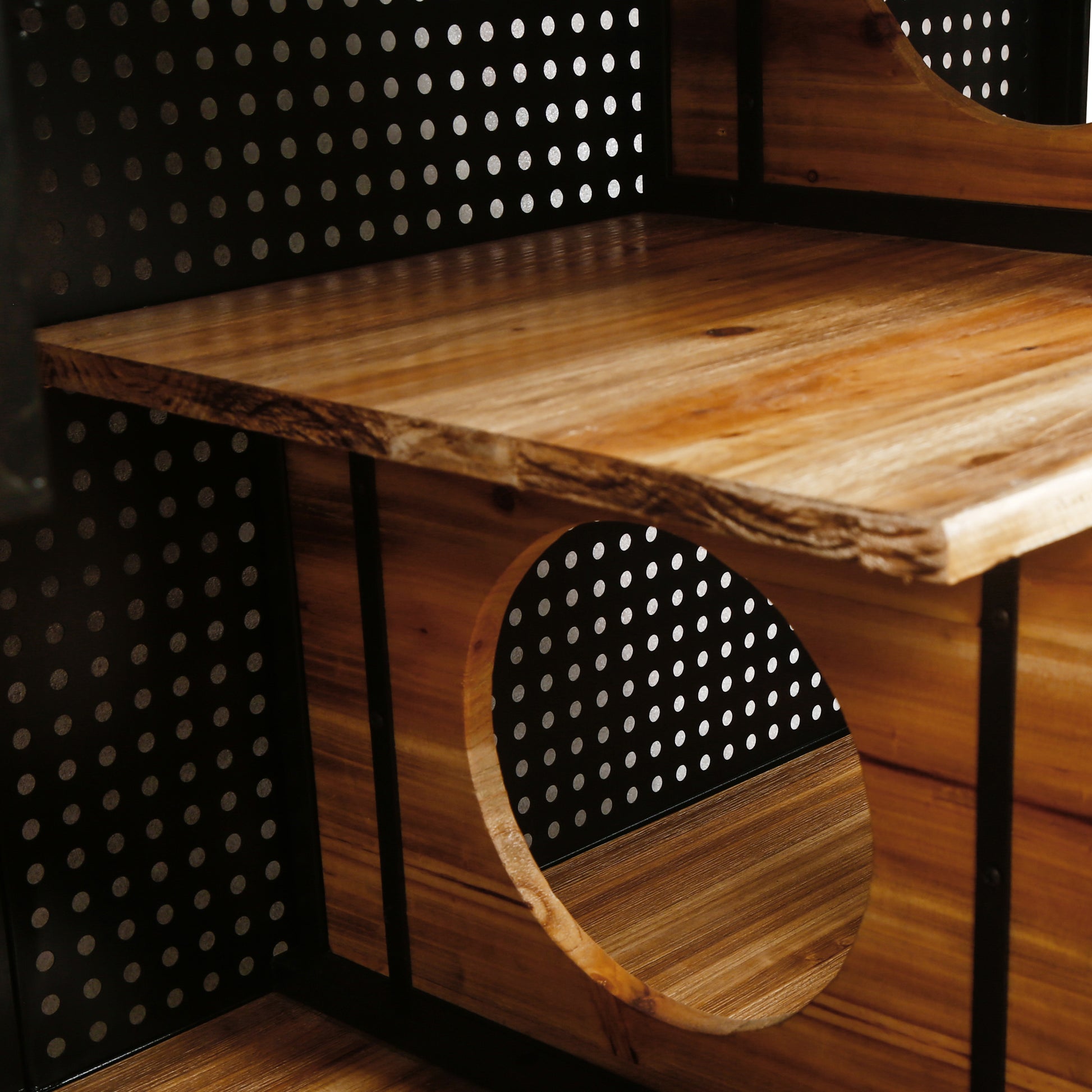 Wooden tiered cat tree with black perforated panels and circular openings