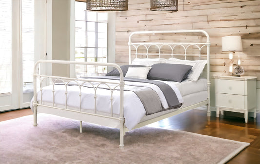 White metal vintage bed frame with arched headboard and footboard