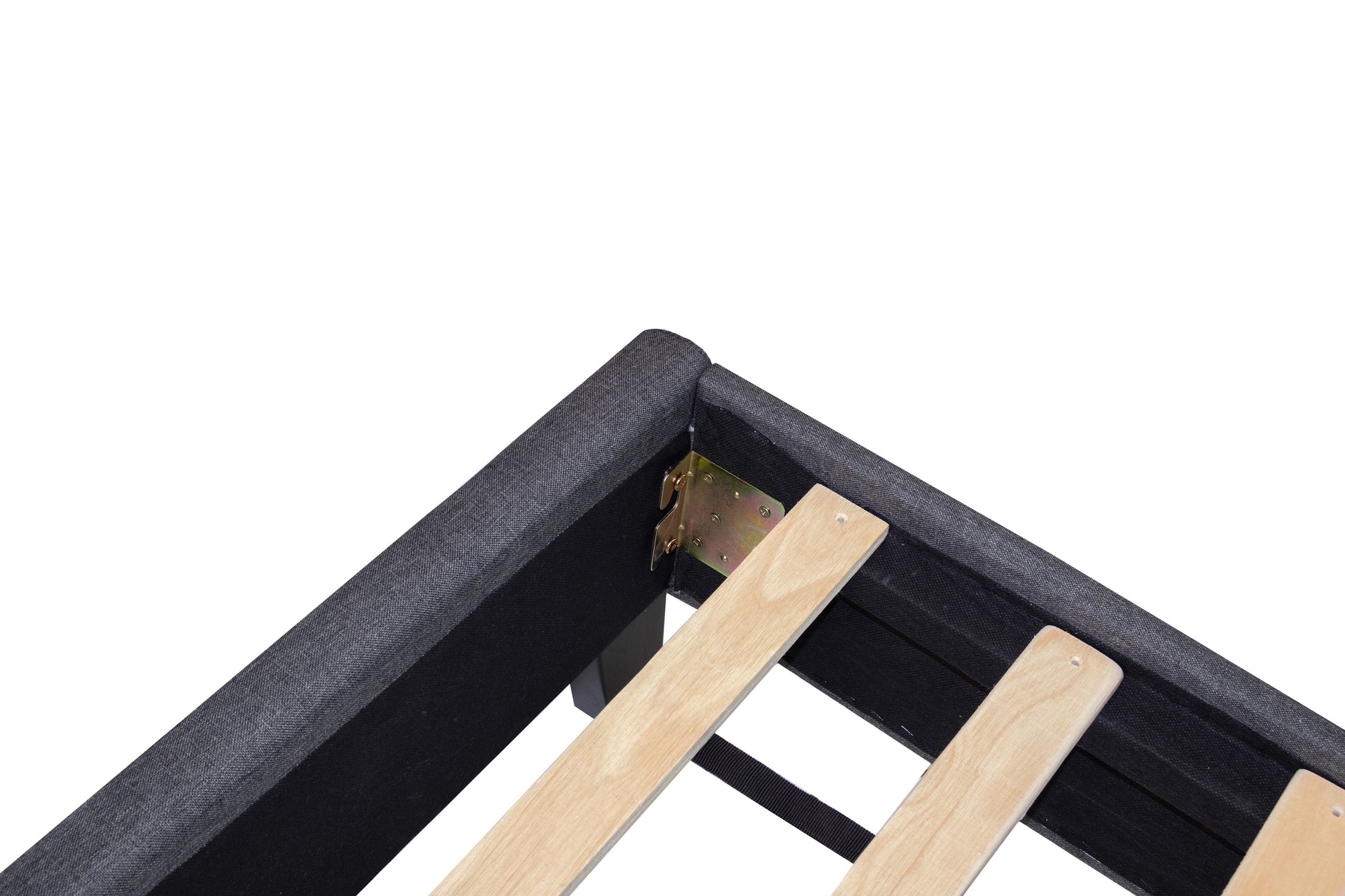 Closeup of dark grey fabric bed frame corner with metal brackets and wooden slats