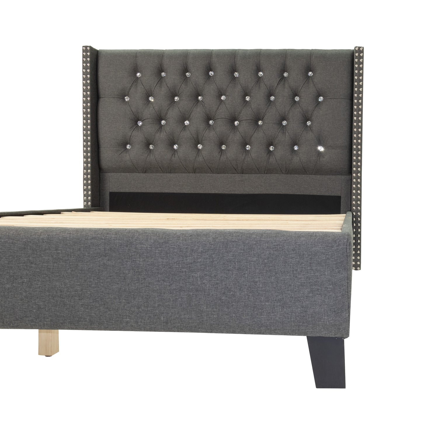 Dark grey upholstered bed frame with crystal tufting and silver nailhead trim