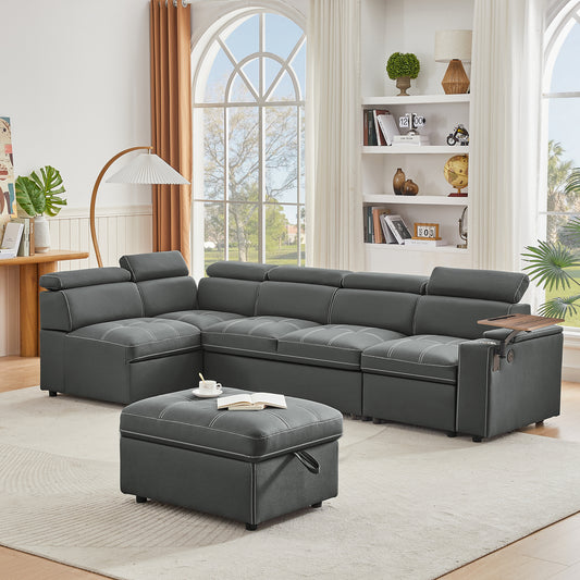Dark gray leather sectional sofa with white stitching and a matching ottoman