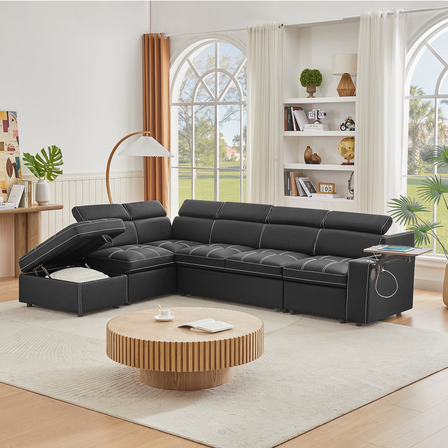 Black sectional sofa with white stitching and hidden storage for modern living rooms